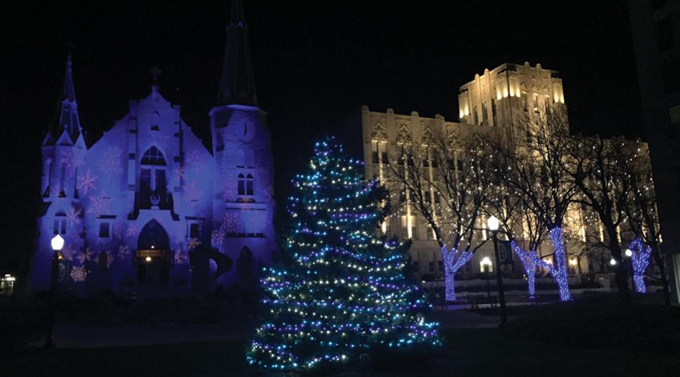 Christmas lights outside St. John's church at night.