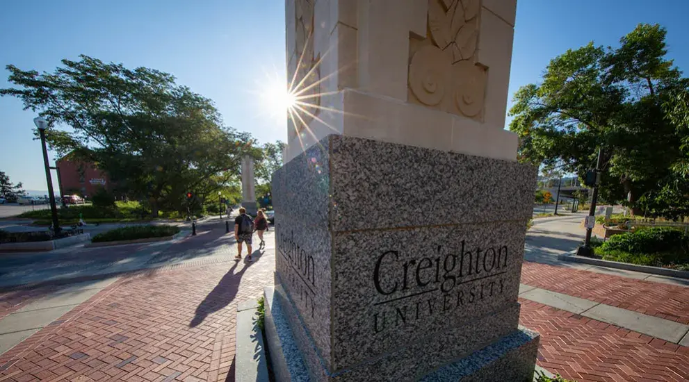 Creighton pillar on mallway with morning sun.