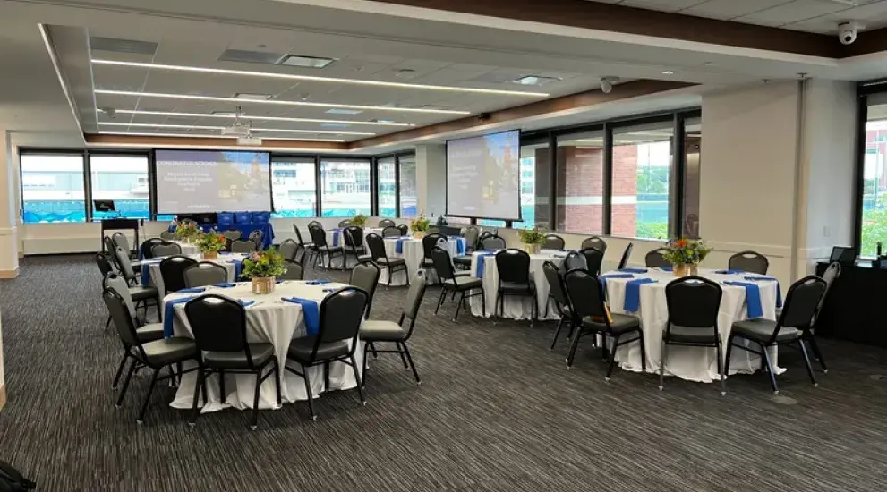 Large room with circular tables.