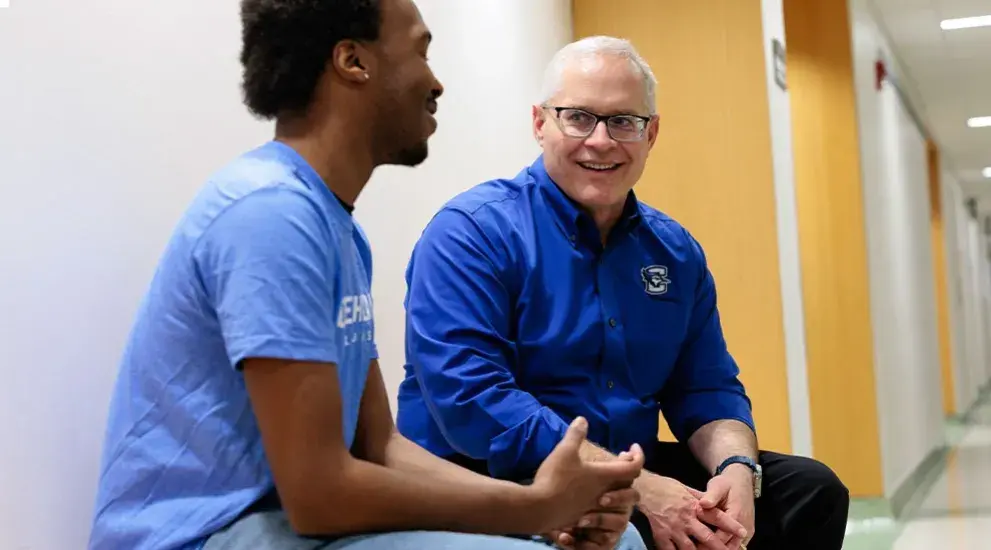 Student discussing future goals with advising staff member.