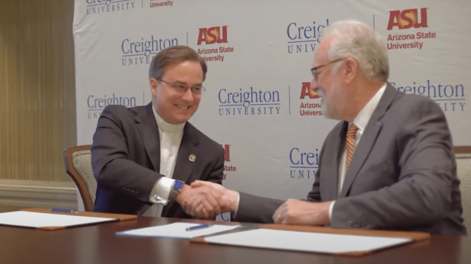 Daniel Hendrickson shaking hands on Creighton Arizona State partnership
